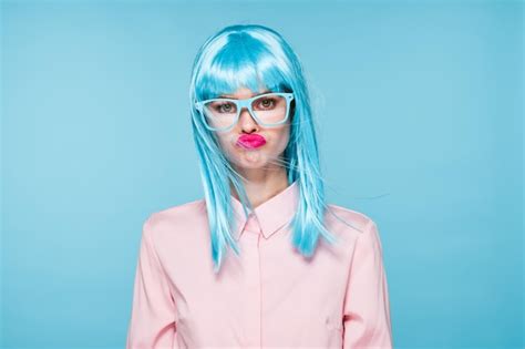 Premium Photo Portrait Of Woman Wearing Sunglasses Against Blue