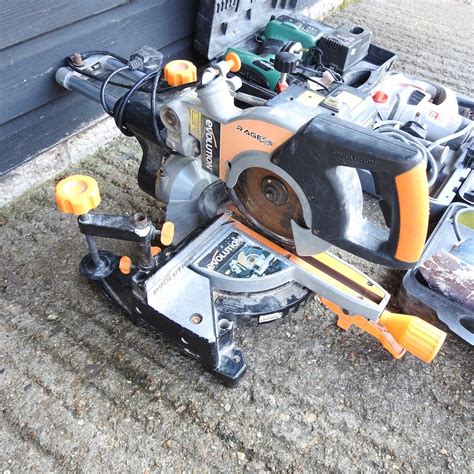 Lot 117 An Evolution Chop Saw Together With A
