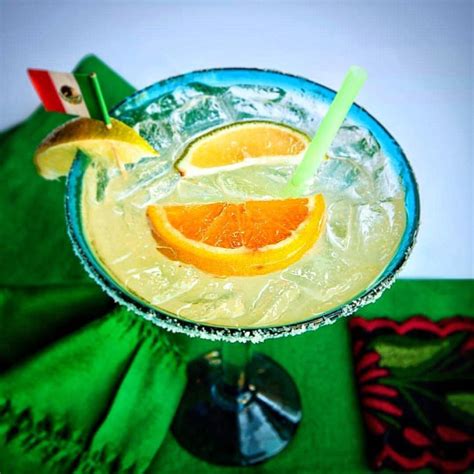 a margarita with orange slices on the rim