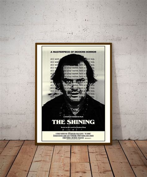 The Shining Movie Poster In A Frame On A Wooden Floor