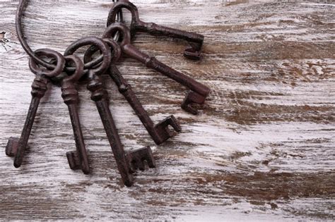 Premium Photo Bunch Of Old Keys On Wooden Background Close Up