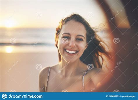 Im All About My Beach Time Cropped Shot Of A Young Woman Enjoying Her