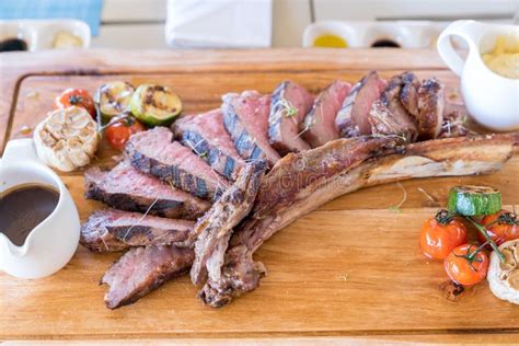 Grilled tomahawk steak stock image. Image of roasted - 133119245