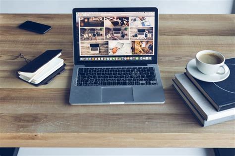 Open Laptop Books And Cup Of Coffee At Modern Editorial Photo Image