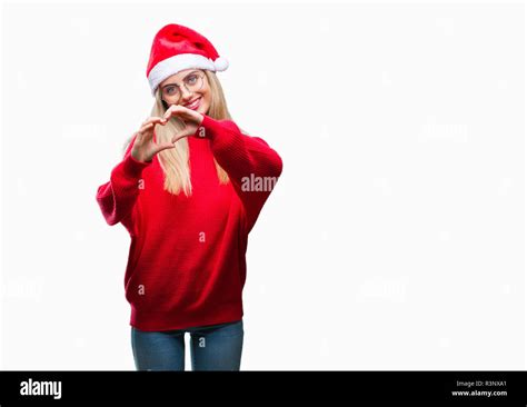 Young Beautiful Blonde Woman Wearing Christmas Hat Over Isolated