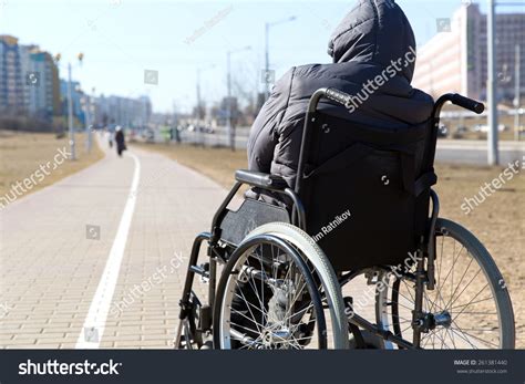 Disabled Handicapped Person On Wheeled Chair Stock Photo 261381440