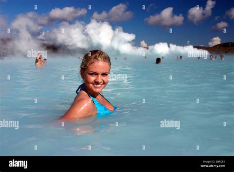 ICELANDIC WOMAN BATHING IN THE BLUE LAGOON HOT WATER SPRING