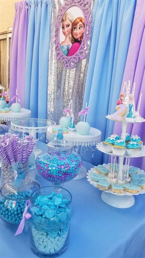 There Are Many Desserts On The Table At This Princess Birthday Party