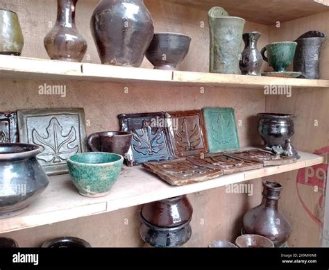 Glazed Pottery On Display Of Handcrafted Ceramic Pottery On Wooden