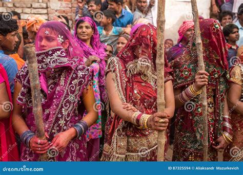 Women Beat Up Men With Long Sticks As A Ritual In The Lathmar Holi