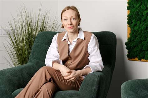 Premium Photo Portrait Of Cheerful Middle Aged Woman In Office Rest Room