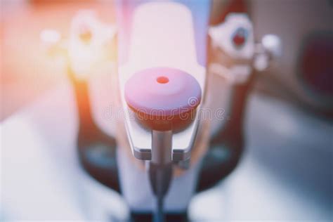 Dental Technician Working With Articulator In Dental Lab Stock Photo