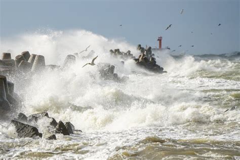 High Waves Crash Against The Concrete Tetrapods Of The Harbor