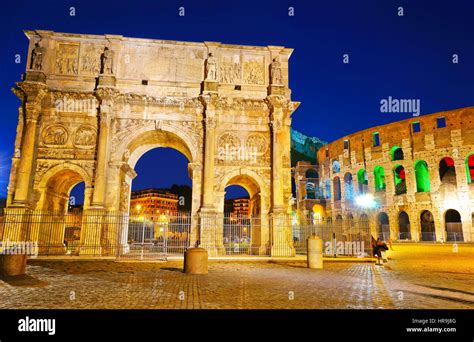 View Of The Arch Of Constantine And Colosseum At Night In Rome Italy