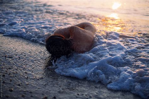 Naked Girl In The Sea At Sunrise By Stocksy Contributor Demetr White Stocksy