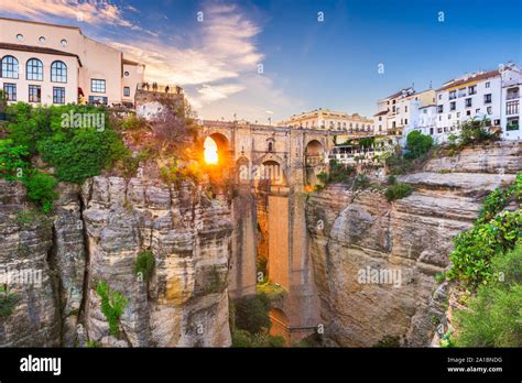 Ronda, Spain at Puente Nuevo Bridge at sunset Stock Photo - Alamy