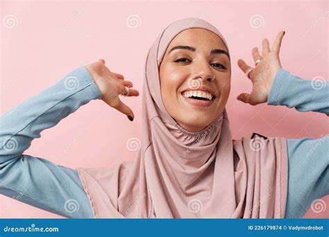 A Portrait Of The Laughing Muslim Woman Wearing Pink Hijab Standing