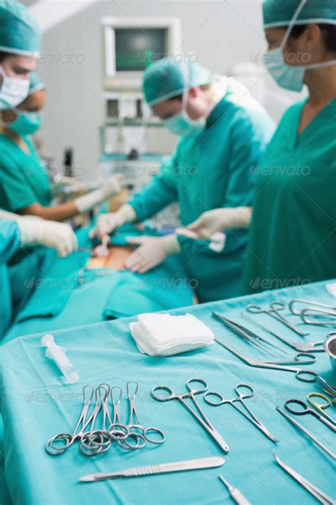 Surgical tools displayed on a surgical tray while surgeons are operating in a hospital Stock ...