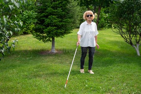 Elderly Blind Woman Walking In The Park Stock Photo Image Of Glasses