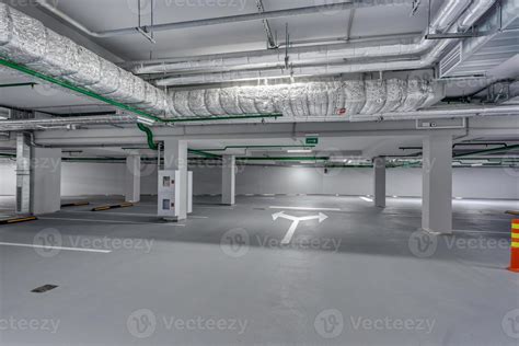 Empty Underground Garage Parking With Columns And Road Markings