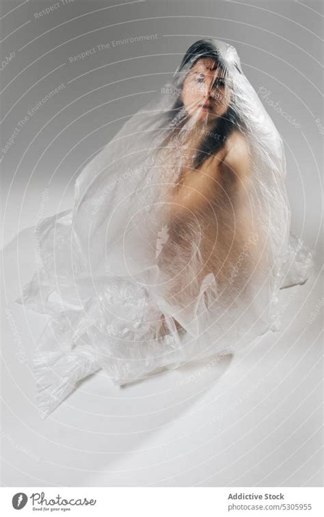 Naked Woman Wrapped In Cellophane A Royalty Free Stock Photo From