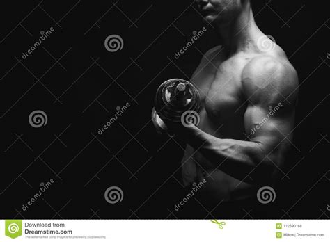 Strong Athletic Man With Dumbbell Showes Naked Muscular Body Stock