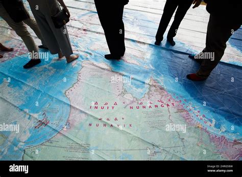 People Stand On A Giant Map From The Indigenous Peoples Atlas Of Canada