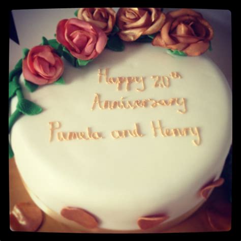 a white cake with flowers on it and the words happy 20th anniversary ...