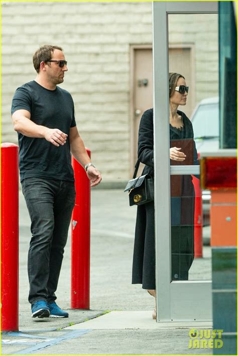 Angelina Jolie Carries Shilohs Crutches While Going To The Movies