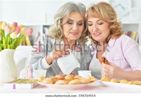 Two Beautiful Mature Women Having Breakfast Stock Photo
