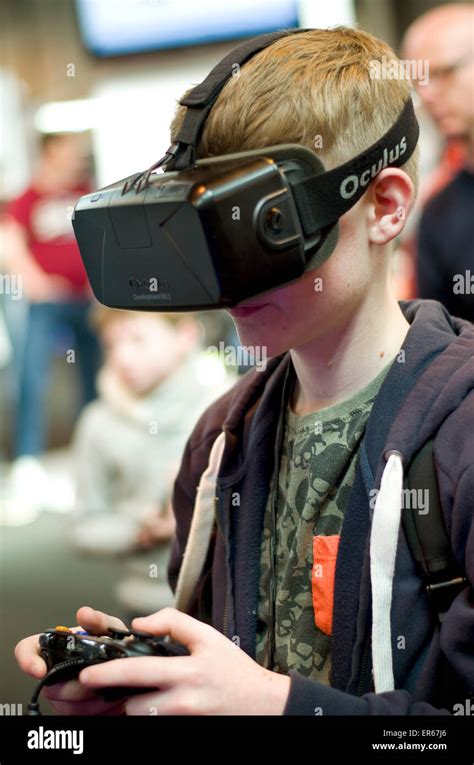 Young Male Wearing Oculus Rift 3d Virtual Reality Goggles With Game