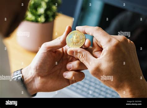 Man Holding Bitcoin In Hand Crypto Buying And Investment Concept