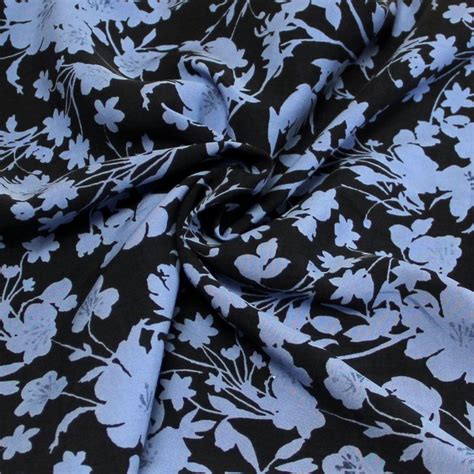 Toile 100 viscose Fleuri bleu fond noir vendu au mètre