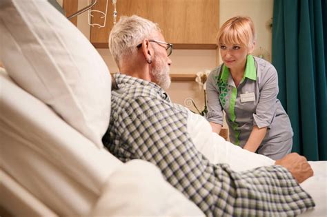 Blonde Nurse Gives An Injection Into Vein Of Elderly Man Stock Photo Image Of Located