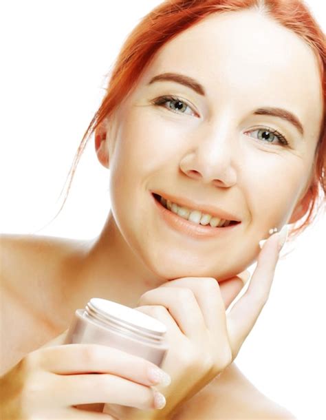 Premium Photo Young Smiling Woman Applying Cream