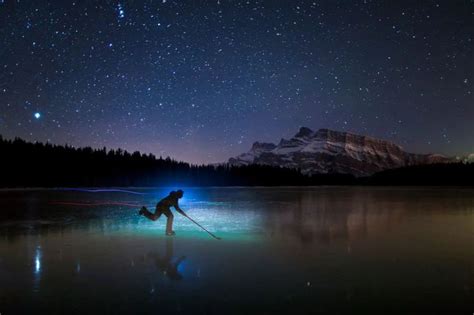 This Banff photographer captures stunning wild ice skating moments in ...