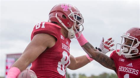 Jordan Fuchs is congratulated by Shane Wynn after Fuchs' touchdown ...