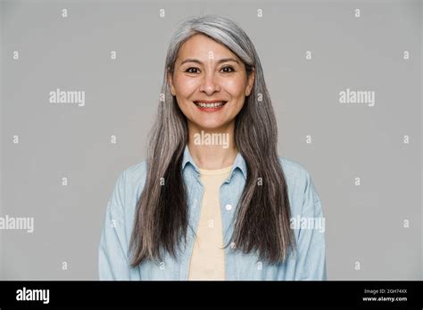 Mature White Haired Woman Smiling And Looking At Camera Isolated Over