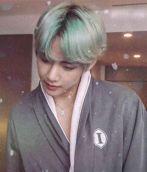 A Man With Green Hair Wearing A Robe