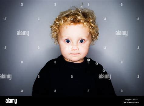 Portrait Of Young Boy With Big Blue Eyes Stock Photo Alamy