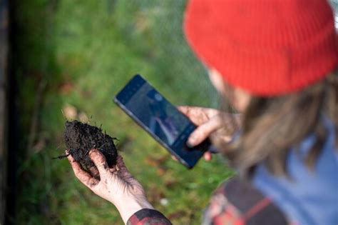 Premium Photo Female Farmer Using Technology To Test Soil Farmer