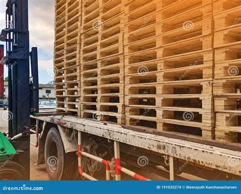 Worker Driving Forklift To Loading And Unloading Wooden Pallets From