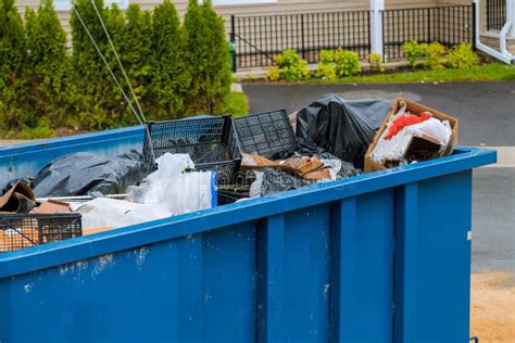 Construction Trash Dumpsters In An Metal Container Stacker Wooden