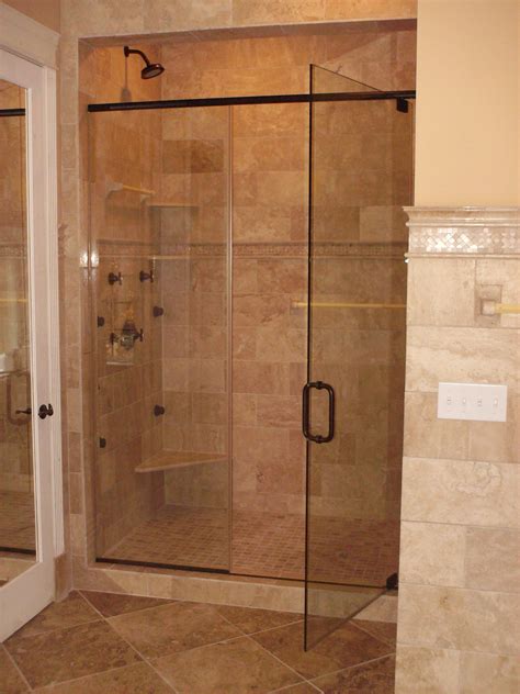 This Type Of Glass Shower Enclosure With The Light Colored Tiled Floor