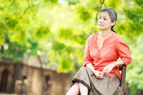 Portrait Of Serene Mature Woman In Garden Stock Photo Image Of Taiwan
