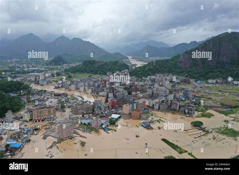 The Residential Buildings And Fields Are Submerged In Floodwater After