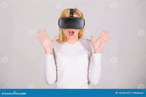 Beautiful Woman Wearing Virtual Reality Goggles In Studio Woman Using