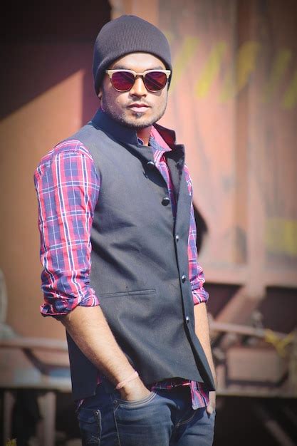 Premium Photo Portrait Of Young Man Wearing Sunglasses Standing Outdoors