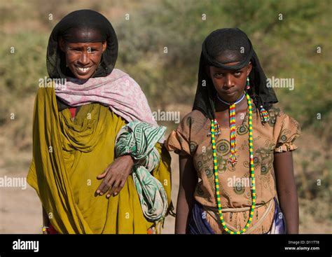 Portrait Of Smiling Oromo Tribe Women With Black Headscarf And Colourful Necklaces On The Road