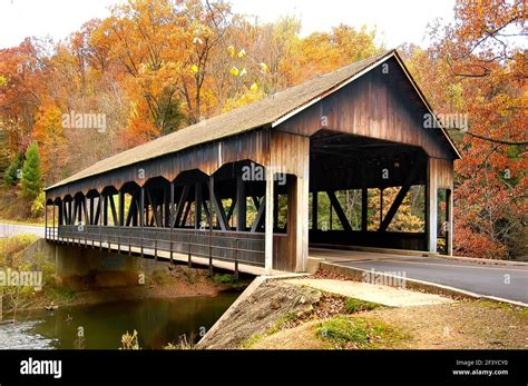 Fall colors with a wooden bridge at Mohican State Park in northern Ohio ...